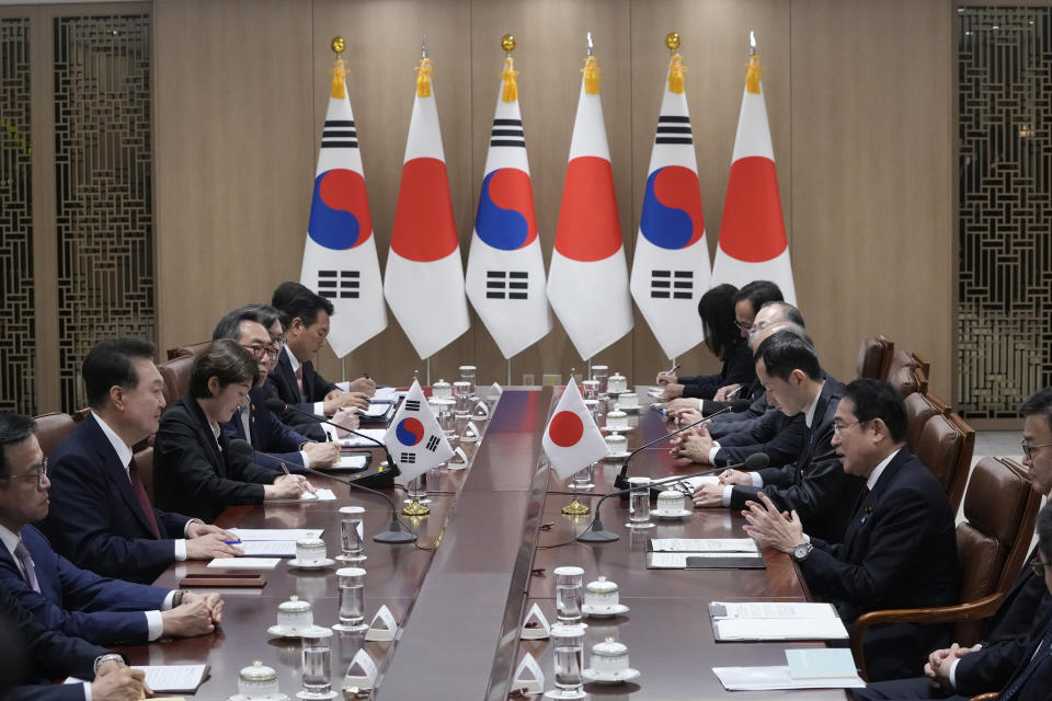 Japanese Prime Minister Fumio Kishida, second from right, speaks to South Korean President Yoon Suk Yeol, second from left, during a meeting at the Presidential Office in Seoul, South Korea, Sunday, May 26, 2024. (AP Photo/Ahn Young-joon, Pool)