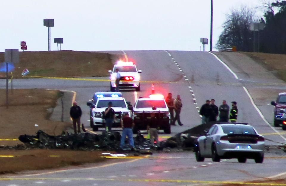 In this image provided by Chris Montgomery, law enforcement work at the scene of a Black Hawk helicopter crash, in the unincorporated community of Harvest, Ala. U.S. military officials say two people on board the helicopter, which was from the Tennessee National Guard, were killed Helicopter Crash, Harvest, United States - 15 Feb 2023