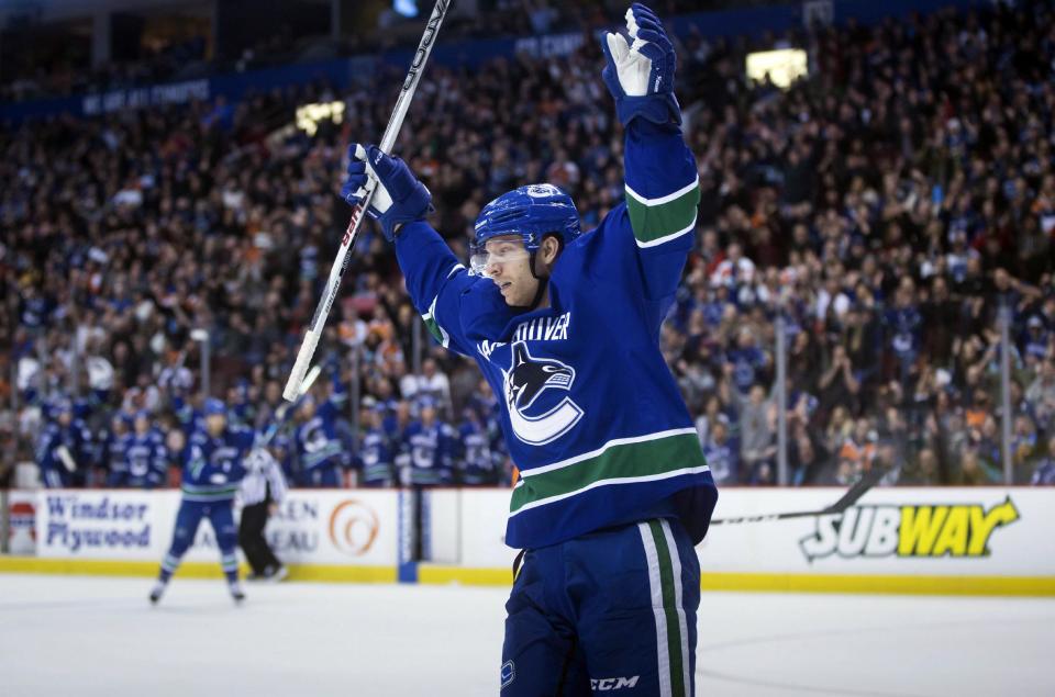 FILE - In this Sunday, Feb. 19, 2017, file photo, Vancouver Canucks' Jannik Hansen, of Denmark, celebrates his goal against the Philadelphia Flyers during the second period of an NHL hockey game in Vancouver, British Columbia. The San Jose Sharks have acquired Hansen from the Canucks late Tuesday, Feb. 28, 2017, for prospect Nikolay Goldobin and a conditional draft pick. (Darryl Dyck/The Canadian Press via AP, File)