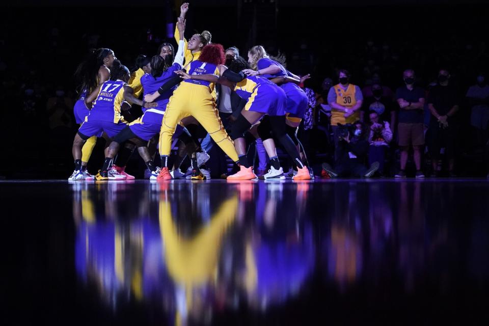 The Sparks huddle before their game against the Connecticut Sun.