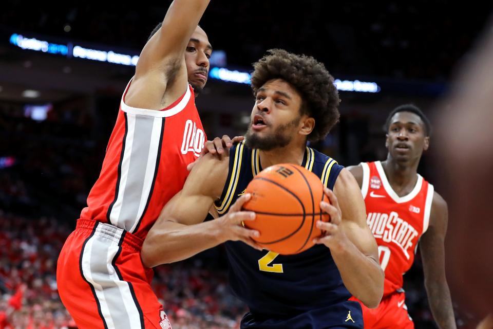 Michigan's Tray Jackson looks to score as Ohio State's Zed Key defends during the first half at Value City Arena, March 3, 2024 in Columbus, Ohio.