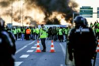 Police moved in to break up road blocks near the northern city of Caen after reports of vandalism