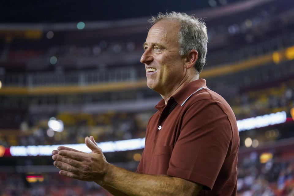 Washington Commanders owner Josh Harris applauds his team after an NFL preseason football game against the Baltimore Ravens, Monday, Aug. 21, 2023, in Landover, Md. (AP Photo/Stephanie Scarbrough)