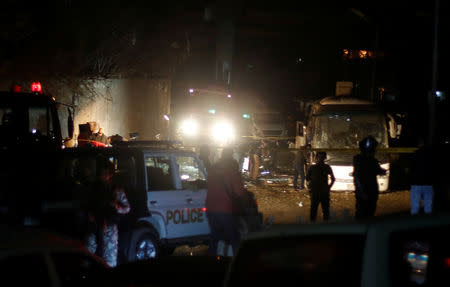 Police inspect a scene of a bus blast in Giza, Egypt, December 28, 2018. REUTERS/Amr Abdallah Dalsh