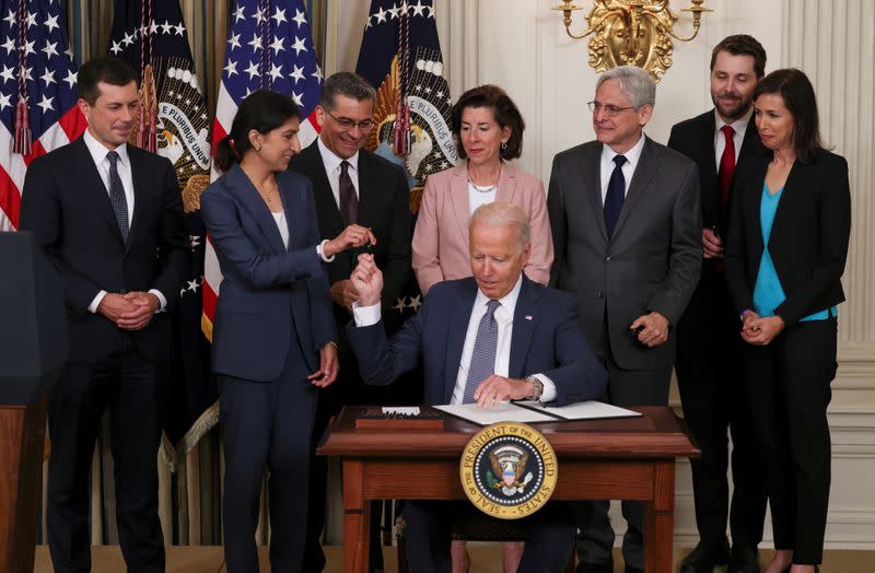 FILE PHOTO: U.S. President Biden signs executive order on U.S. economy at the White House in Washington