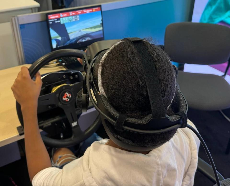 An attendee tries out the driving simulator Nicklaus Children’s Hospital is offering patients with neurological conditions, such as autism, to prepare them for driving in the real world. The technology was showcased Thursday, April 18 during the 10th annual eMerge Americas conference in Miami Beach, FL.