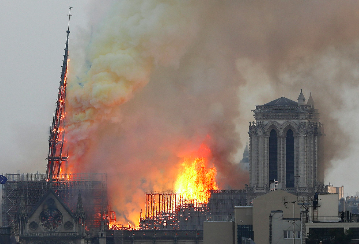 The spire of the Notre Dame cathedral was completely destroyed as smoke billows into the Parisian skyline. Source: AP