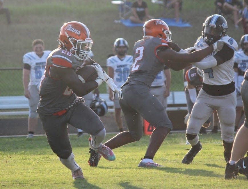 Beechie Morris (20) ran eight times for 39 yards and caught a touchdown for University its opening win over Hagerty.