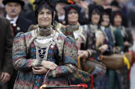 <p>A young woman participates in the traditional costume and riflemen parade. (AP Photo/Matthias Schrader) </p>