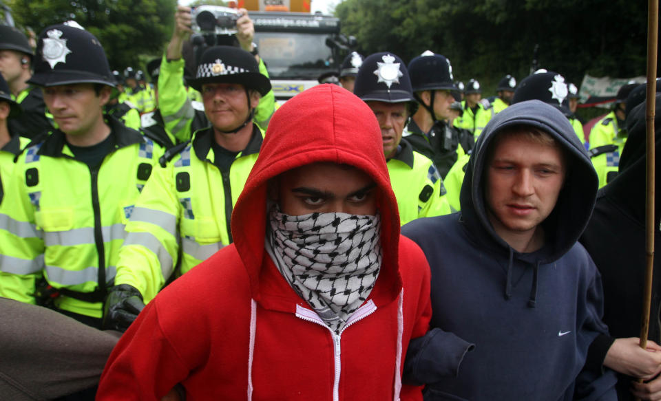 Protesters attempt to slow vehicles down that are arriving at the Balcombe fracking site in West Sussex as energy company Cuadrilla has started testing equipment ahead of exploratory oil drilling in the English countryside as anti-fracking protests at the site entered a ninth day.