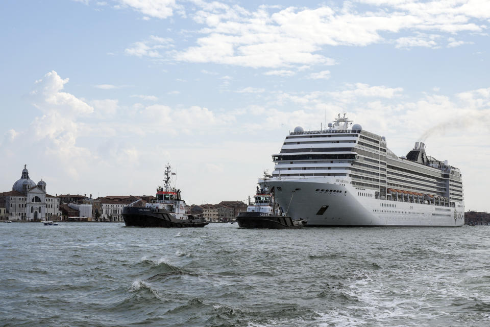 FILE - In this June 5, 2021 file photo, the MSC Orchestra cruise ship leaves Venice, Italy. UNESCO’s World Heritage Committee is debating Thursday, July 22, 2021, whether Venice and its lagoon environment will be designated a world heritage site in danger due to the impact of over-tourism alongside the steady decline in population and poor governance. (AP Photo/Antonio Calanni, file)