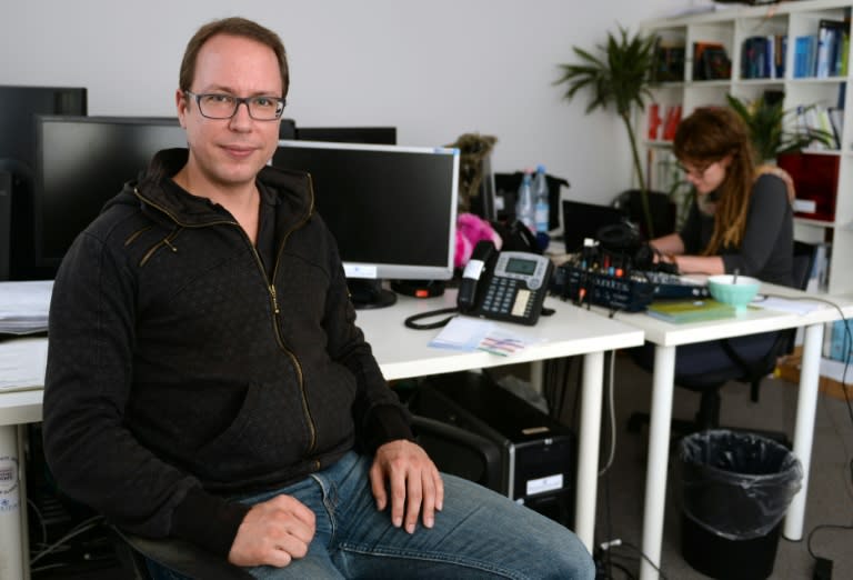 The founder of German news blog Netzpolitik Markus Beckedahl poses in his editorial office in Berlin on October 10, 2014