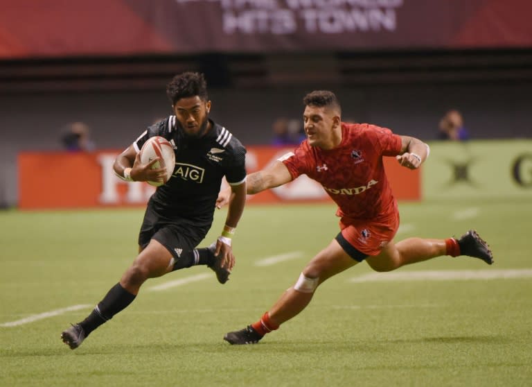 New Zealand (in black) and Canada compete during the HSBC Canada Sevens Vancouver tournament, at BC Place Stadium, on March 11, 2017