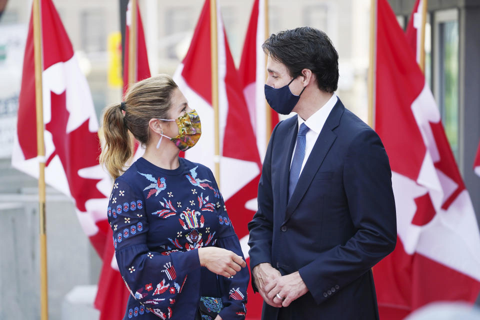 Canadian Prime Minister Justin Trudeau and wife Sophie Gregoire Trudeau look at each other as they arrive for the installation of Mary Simon as Governor-General of Canada in Ottawa, Ontario, Monday, July 26, 2021. (Sean Kilpatrick/The Canadian Press via AP)