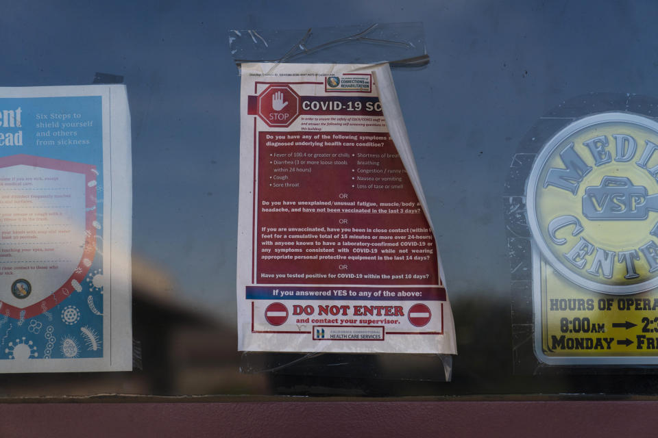 A worn-out bulletin with COVID-19 preventive measures is seen on the door of a chapel at Valley State Prison in Chowchilla, Calif., Friday, Nov. 4, 2022. In a nation that incarcerates roughly 2 million people, the COVID pandemic was a nightmare for prisons. The highly contagious virus disrupted the very educational and rehabilitative programs prisoners most desperately need. (AP Photo/Jae C. Hong)