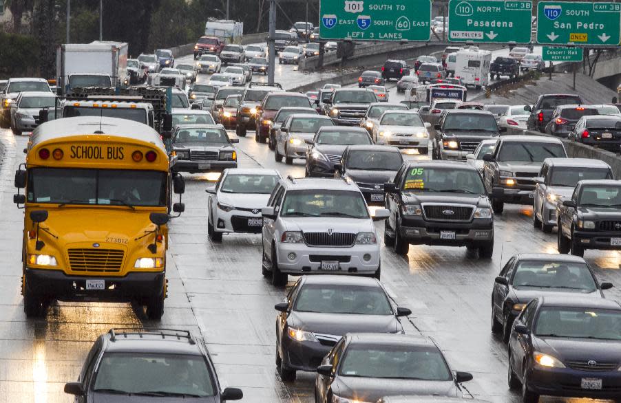 In this Thursday, Feb. 6, 2014 photo, traffic on the eastbound Hollywood Freeway, U.S. Highway 101, approaches the four-level interchange in downtown Los Angeles. A newly released report by the California Department of Transportation (CalTrans) ranks Interstate 5 in Los Angeles County as the most congested highway in the state, with other county freeways such as the 60, I-10, I-405 and 101 high on the list. In fact, Los Angeles County had the four most congested freeways (and six of the Top 10). The only counties that come close were Orange and Alameda, with two each. (AP Photo/Damian Dovarganes)