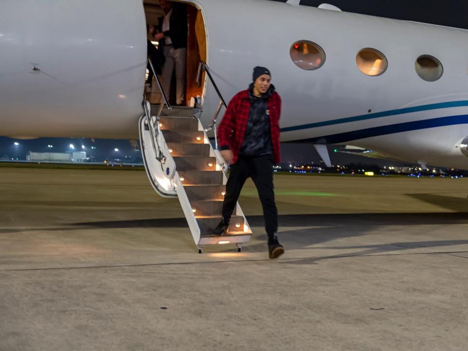 Brittney Griner deboards the plane and takes her first steps back on US soil.