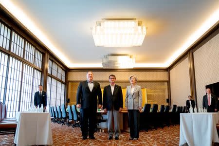 U.S. Secretary of State Mike Pompeo, Japan's Foreign Minister Taro Kono and South Korea's Foreign Minister Kang Kyung Wha pose for members of the media as they meet in Tokyo, Japan, July 8, 2018. Andrew Harnik/Pool via Reuters