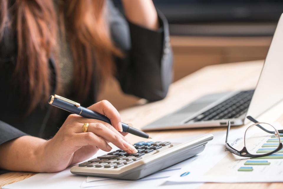 A woman using a calculator