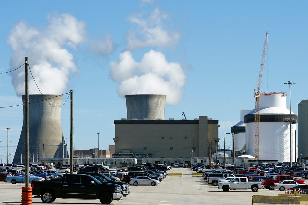 FILE - Reactors for Unit 3 and 4 sit at Georgia Power's Plant Vogtle nuclear power plant on Jan. 20, 2023, in Waynesboro, Ga., with the cooling towers of older Units 1 and 2 billowing steam in the background. Federal regulators announced Friday, July 28, 2023 that Unit 4 is ready for fuel.