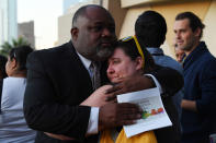 <p>Two people embrace during a vigil at Guardian Angel Cathedral for the victims of the Route 91 Harvest country music festival shootings on October 2, 2017 in Las Vegas, Nevada. (Photo: Denise Truscello/Getty Images) </p>