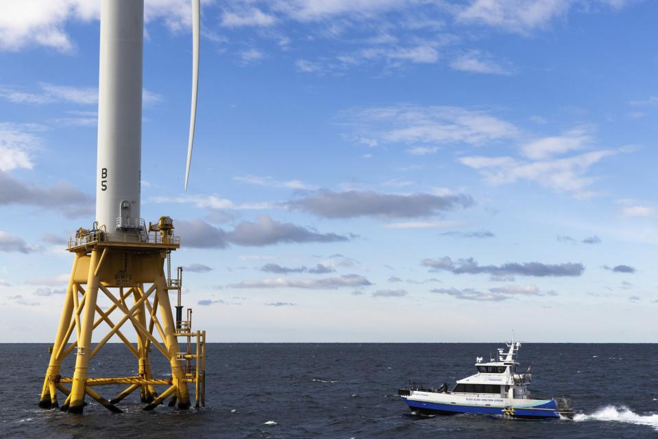 FILE - A Block Island Wind Farm turbine operates, Dec. 7, 2023, off the coast of Block Island, R.I., during a tour of the South Fork Wind farm organized by Orsted. Unfounded claims about offshore wind threatening whales have surfaced as a flashpoint in the fight over the future of renewable energy. (AP Photo/Julia Nikhinson, File)