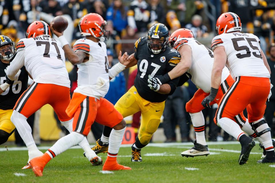 Pittsburgh Steelers defensive tackle Cameron Heyward (97) applies pressure while Cleveland Browns quarterback Deshaun Watson (4) throws a pass during an NFL football game, Sunday, Jan. 8, 2023, in Pittsburgh, PA. (AP Photo/Matt Durisko)