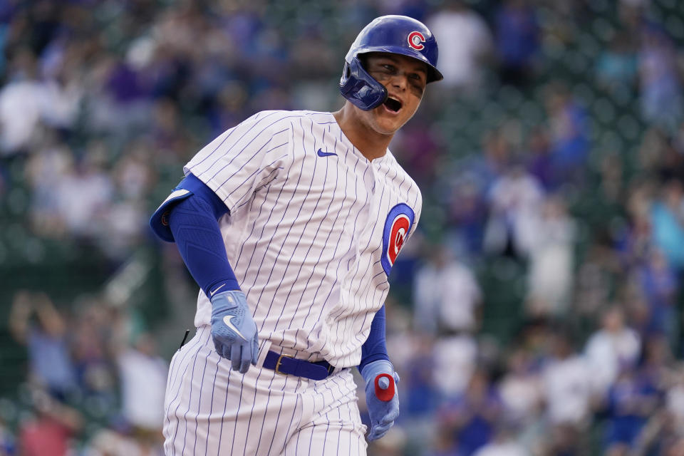 Chicago Cubs' Joc Pederson reacts as he rounds the bases after hitting a solo home run during the eighth inning of a baseball game against the Milwaukee Brewers in Chicago, Wednesday, April 7, 2021. (AP Photo/Nam Y. Huh)