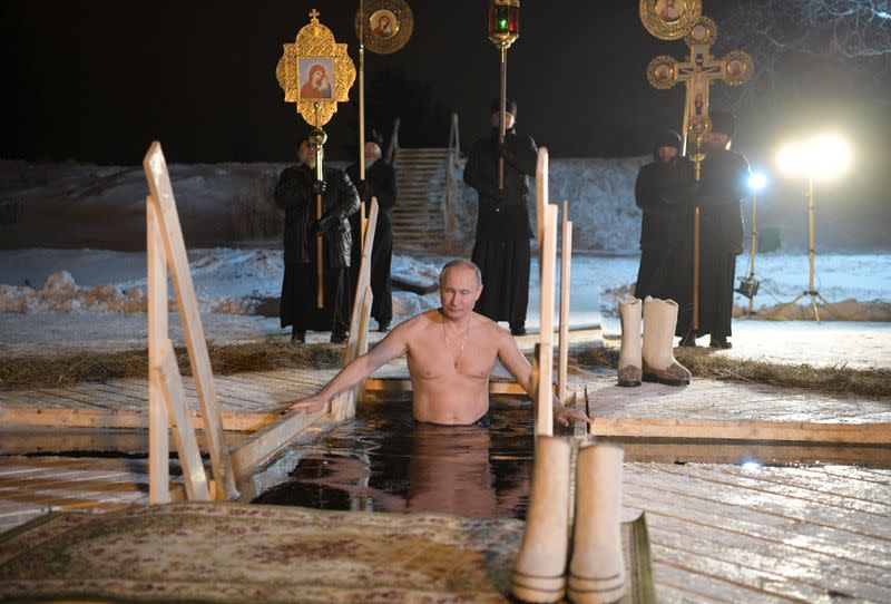 Russian President Vladimir Putin takes a dip in the water during Orthodox Epiphany celebrations at lake Seliger, Tver region