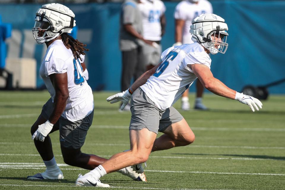 Detroit Lions linebacker Jack Campbell (46) practices with linebacker James Houston (41) during training camp at Detroit Lions Headquarters and Training Facility in Allen Park on Monday, July 24, 2023.