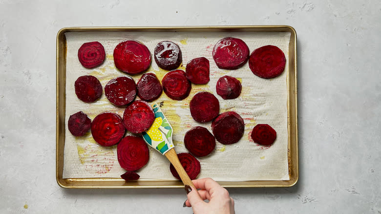 tossing beets with olive oil