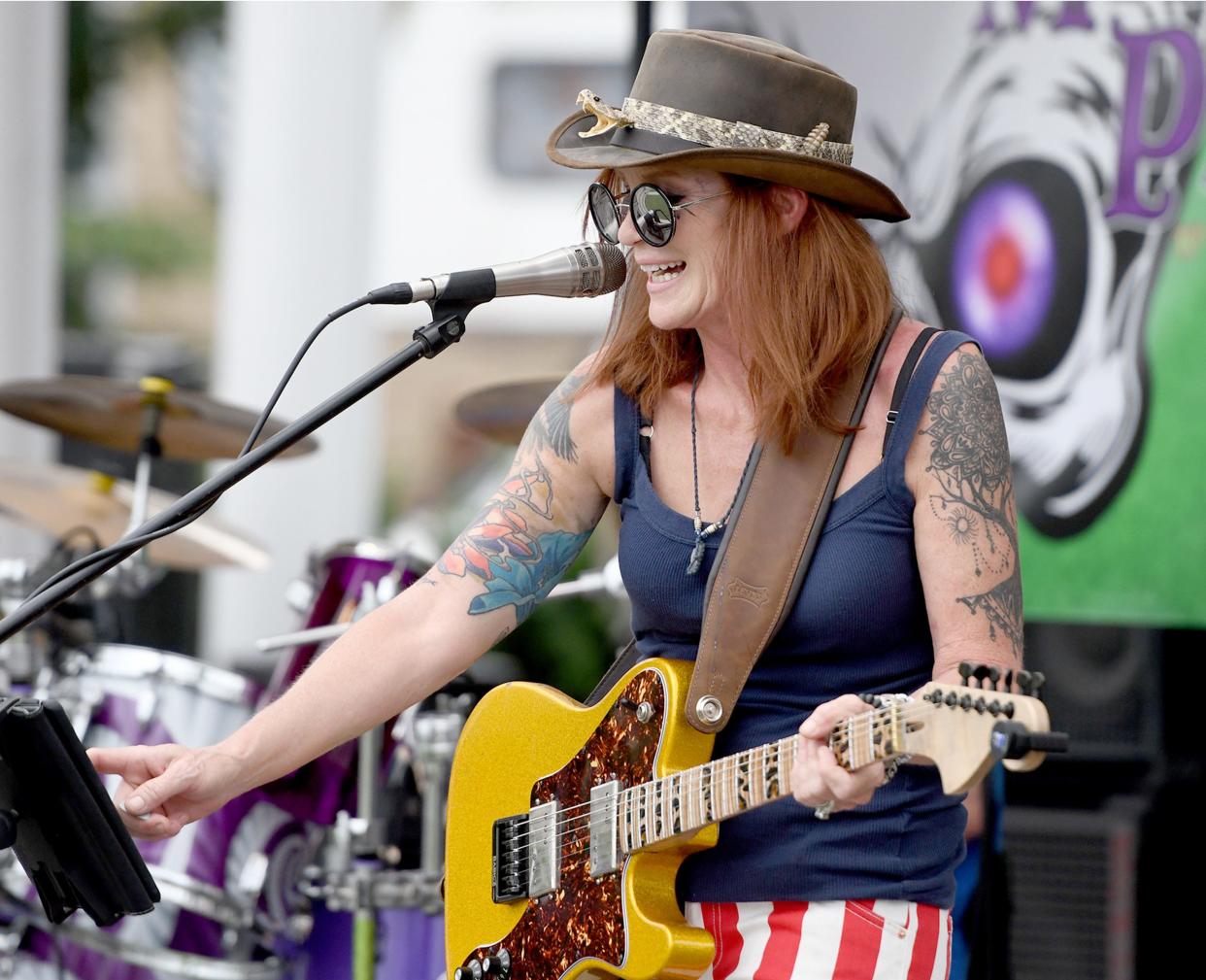 Susan Kresse with The Susan Marie Project performs June 24 at the second annual Canton Ride-In Tailgate event at Canton Centennial Plaza with all proceeds going to Save22, a veteran organization to help prevent veteran suicide.