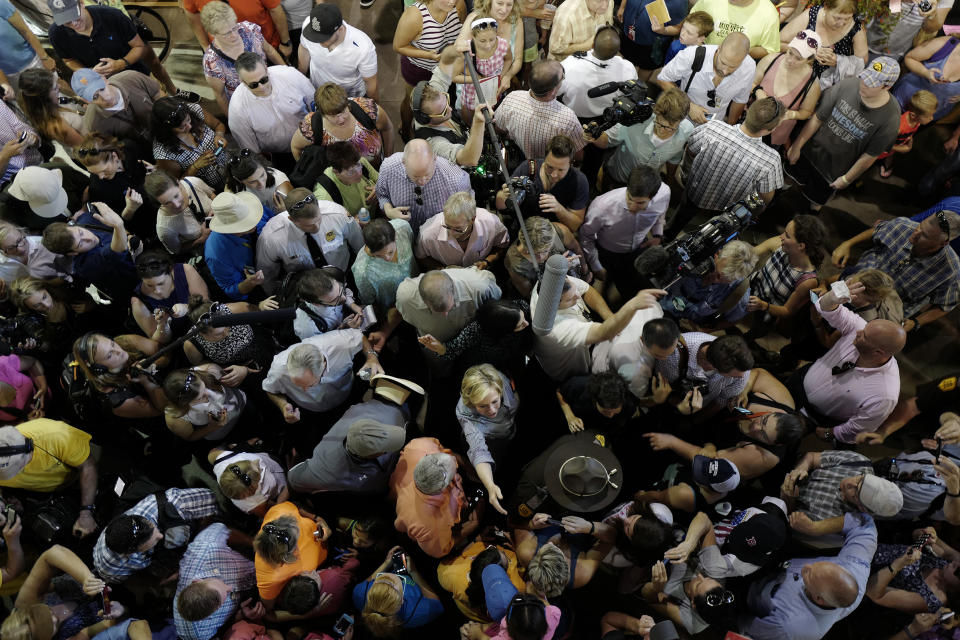 Hillary Clinton is a face in the crowd as she tours the Agriculture Building at the Iowa State Fair in Des Moines, Iowa, on Aug. 15, 2015.