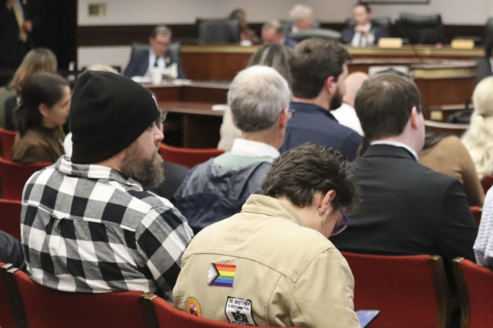 Eric Childs, the father of a transgender boy, sits before a South Carolina legislative committee takes testimony on a bill banning medical care for transgender minors in Columbia, S.C. on Jan. 9, 2024. The proposal advanced Wednesday out of committee for the consideration of the entire South Carolina House.(AP Photo/James Pollard)