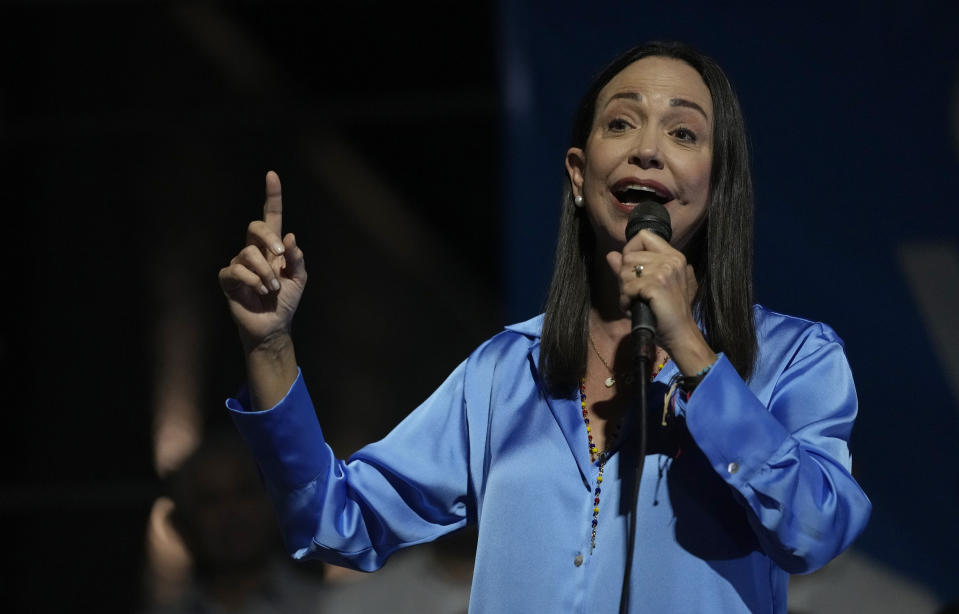 Opposition presidential hopeful Maria Corina Machado, center, speaks to her supporters after winning the opposition primary election, at her campaign headquarters in Caracas, Venezuela, Monday, Oct. 23, 2023. Machado will run against President Nicolás Maduro in the 2024 presidential elections. (AP Photo/Ariana Cubillos)