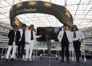 Members of the Mexican grupera band Los Bukis, from left, Pedro Sanchez, Roberto Guadarrama, Marco Antonio Solis, on screen Joel Solis and Pepe Guadarrama, and Eusebio "El Chivo" Cortez and Jose Javier Solis attend a press conference at SoFi Stadium on Monday, June 14, 2021, in Inglewood, Calif. Twenty five years after their last show as a band, the group announced that they are reuniting for a U.S. tour. (AP Photo/Chris Pizzello)