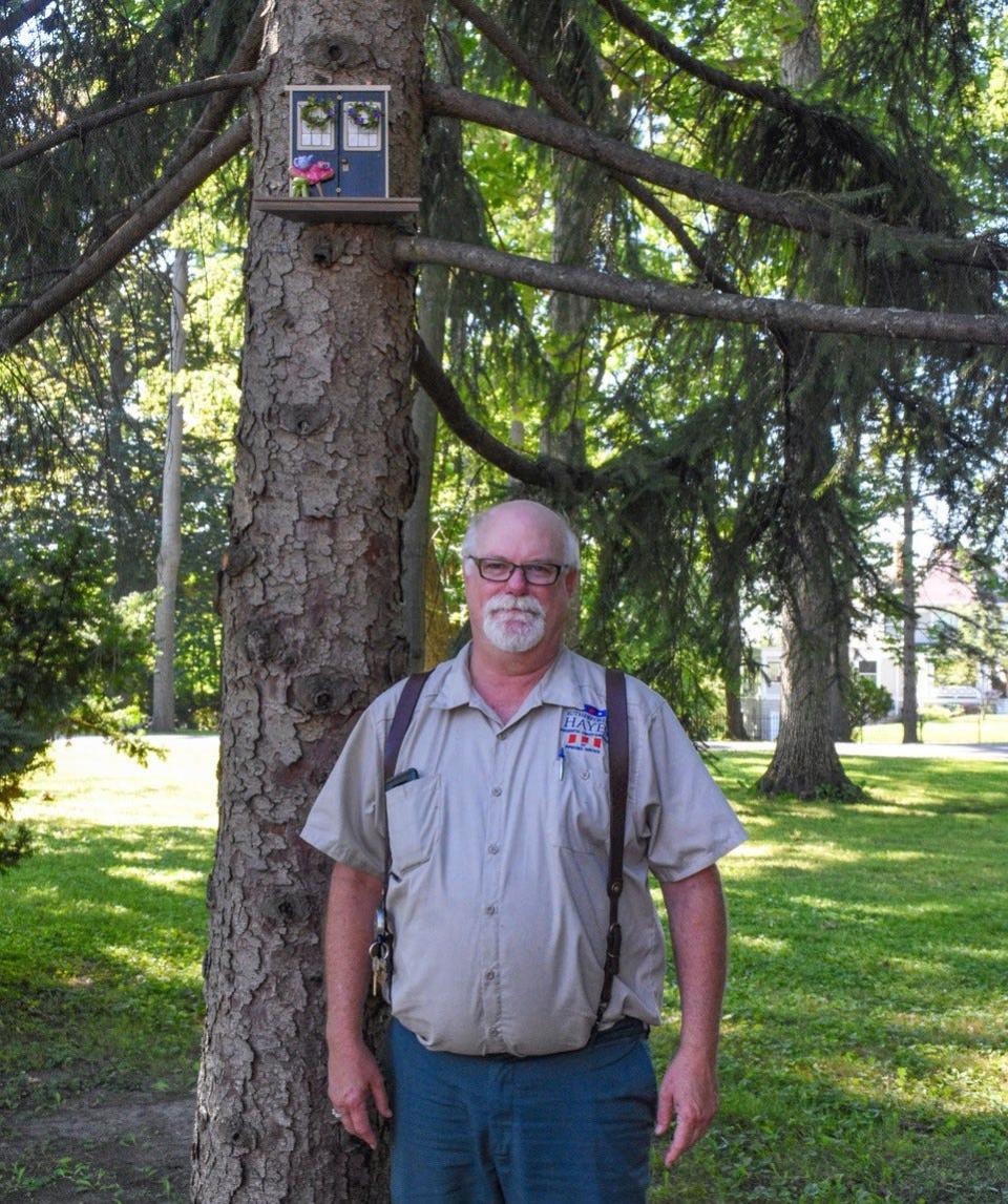 Superintendent of Buildings and Grounds John Havens stands next to one of 10 squirrel doors hidden around Spiegel Grove. Havens created the squirrel doors project in part to promote Spiegel Grove’s fairly new status as an arboretum.