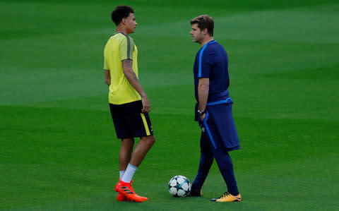 Pochettino talks to Dele Alli at the Bernabeu - Credit: Action Images via Reuters/Andrew Couldridge