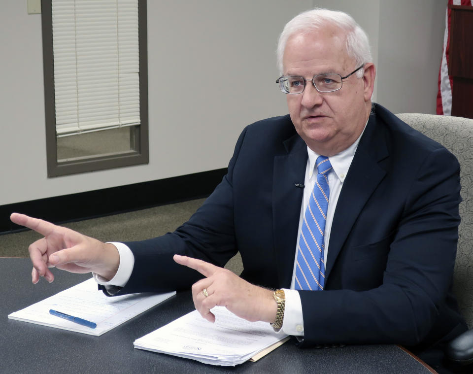 Kansas Revenue Secretary Mark Burghart discusses a new policy that will require out-of-state businesses to collect the state's sales tax on online sales to Kansas residents, during an interview with reporters, Wednesday, Aug. 7, 2019, in Topeka, Kan.. The new policy takes effect in October and some tax experts are calling it the most aggressive in the nation for collecting state and local taxes on online sales. (AP Photo/John Hanna)