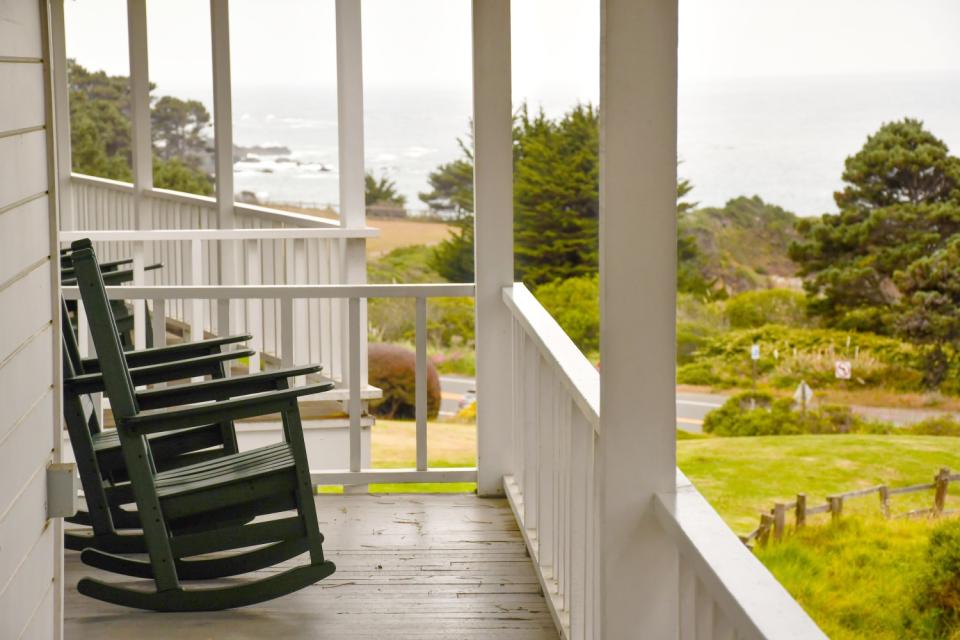 Front porch with rocking chairs at the Little River Inn.