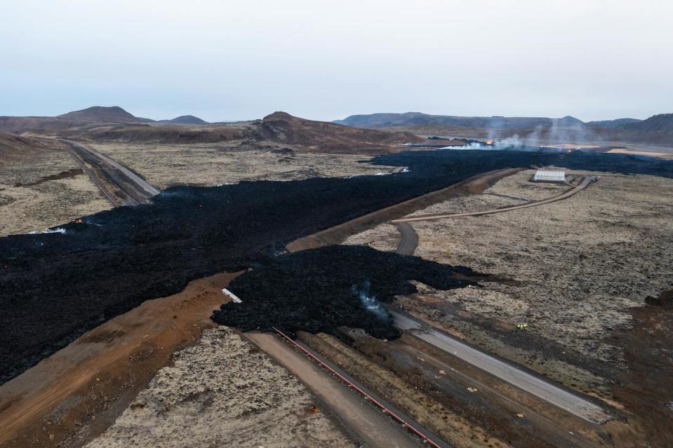 Lava breached one section of the earthen barrier near Grindavík after the Jan. 14, 2024, eruption, but it largely followed the effort to divert it. <a href="https://www.gettyimages.com/detail/news-photo/drone-is-capturing-the-town-of-grindavik-during-the-news-photo/1928389535?adppopup=true" rel="nofollow noopener" target="_blank" data-ylk="slk:NurPhoto via Getty Images;elm:context_link;itc:0;sec:content-canvas" class="link ">NurPhoto via Getty Images</a>