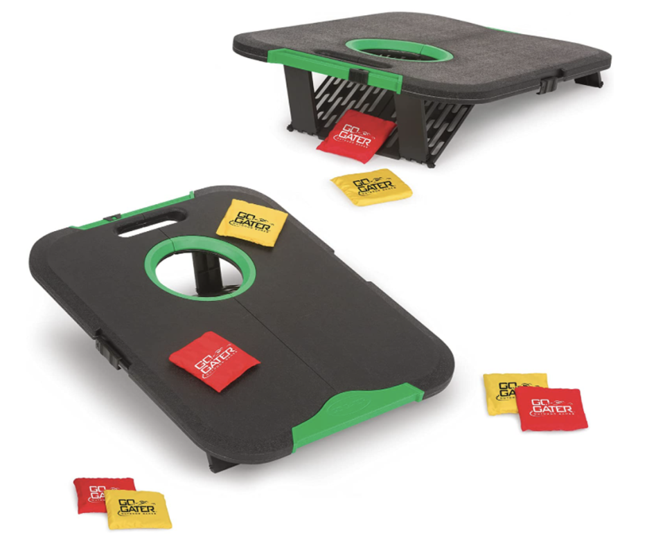 EastPoint Sports Go! Gater Corn Hole Outdoor Game with two grey and green boards and red and yellow bean bags (Photo via Amazon)