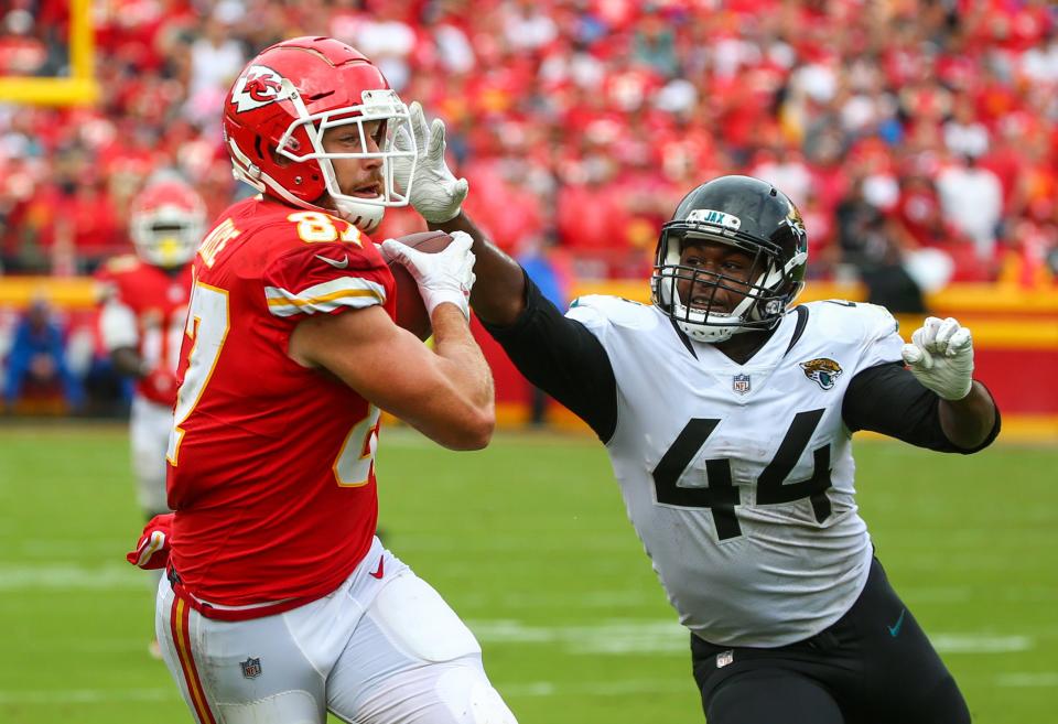 Kansas City tight end Travis Kelce catches a pass over Jaguars linebacker Myles Jack in a 2018 game at Arrowhead Stadium in Kansas City, Mo.