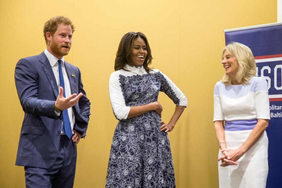Britain's Prince Harry, first lady Michelle Obama and Jill Biden tour the USO Warrior and Family Center at the Fort Belvoir, Va., military base in 2015.