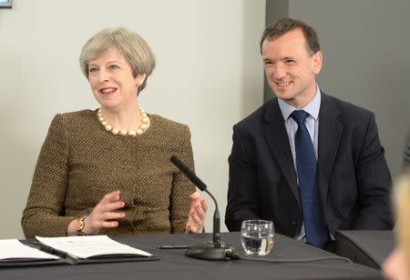 Britain's Prime Minister Theresa May and Welsh Secretary Alun Cairns attend a meeting at the Liberty Stadium in Swansea March 20, 2017. REUTERS/Ben Birchall/Pool