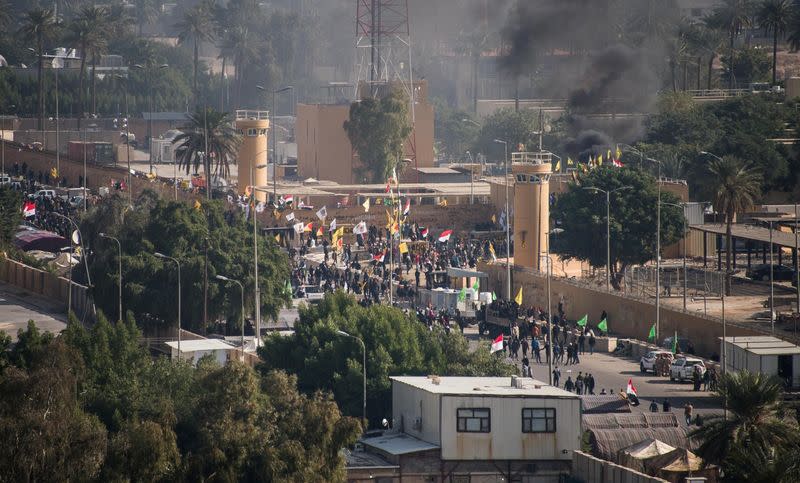 Iraqi security forces deploy during the second day of protests at the U.S. embassy in Baghdad