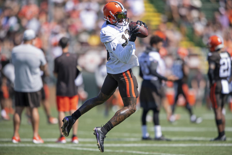 Cleveland Browns receiver Odell Beckham Jr. (13) catches a pass during an NFL football practice in Berea, Ohio, Wednesday, Aug. 4, 2021. (AP Photo/David Dermer)