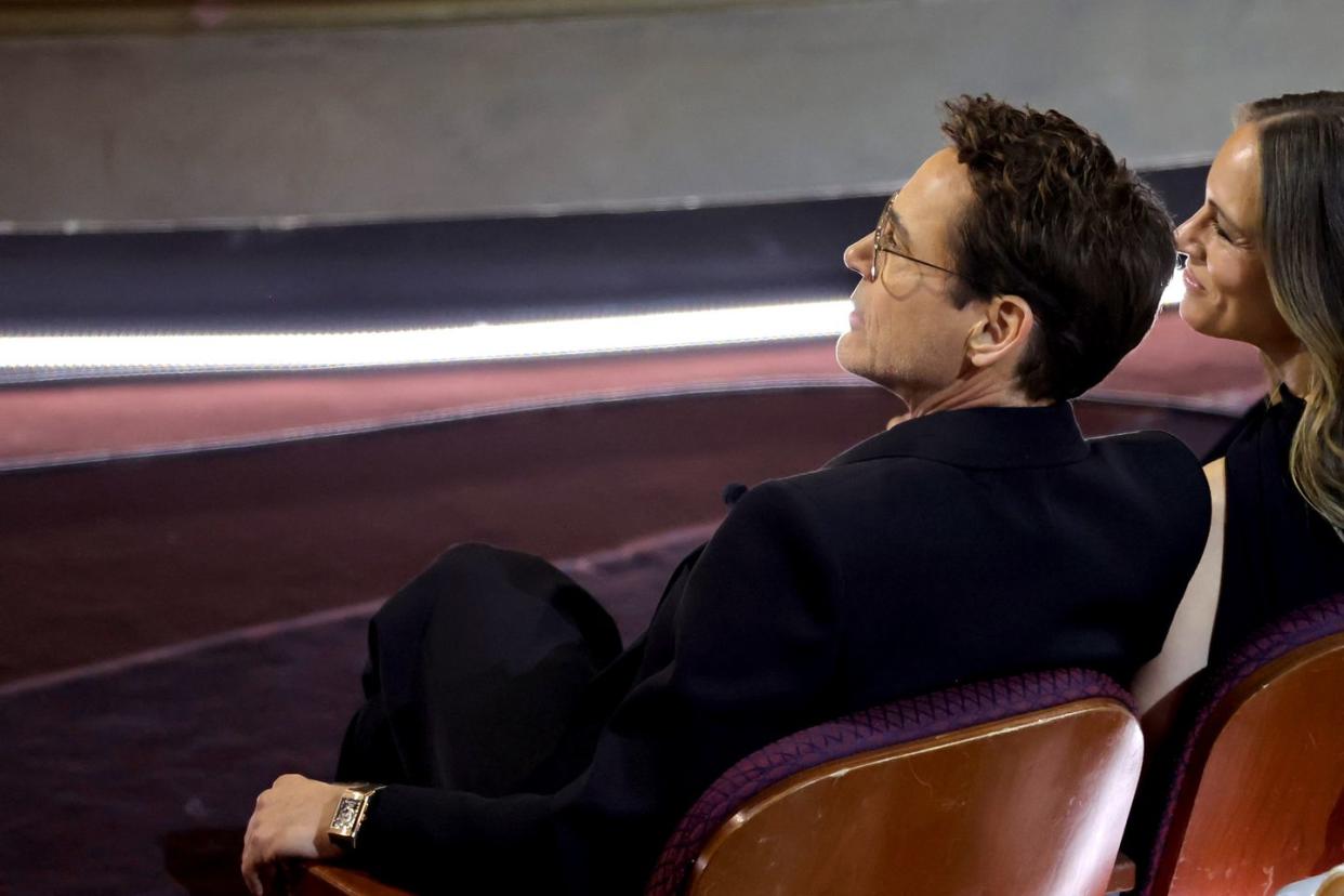 robert downey jr seated during the oscars ceremony