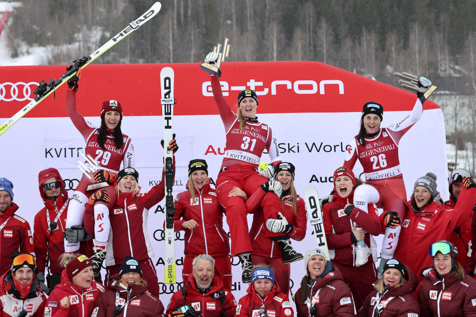 Austria's Nina Ortlieb, center, winner of an alpine ski, women's World Cup super G race, celebrates with second-placed Austria's Stephanie Venier, left, and third-placed Austria's Franziska Gritsch, in Kvitfjell, Norway, Sunday, March 5, 2023. (AP Photo/Marco Trovati)