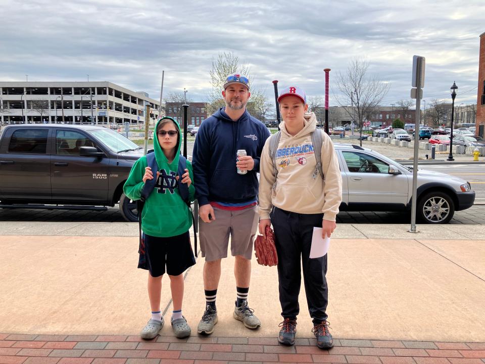 Pete Murphy and his sons, John (left) and Rob (right) seen outside of Canal Park Stadium in downtown Akron for Party in the Park till it's Dark hosted by the Akron RubberDucks.